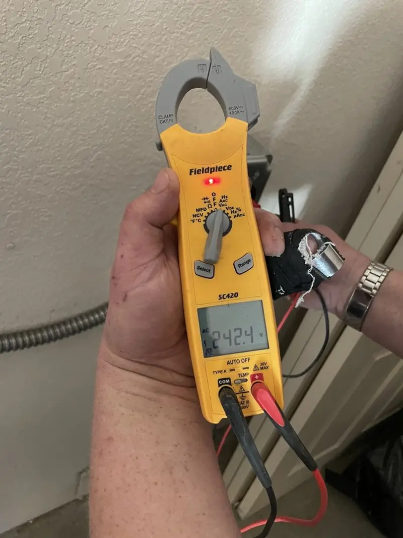 Voltage testing with clamp meter during Ceiling Fan Installation in Selma